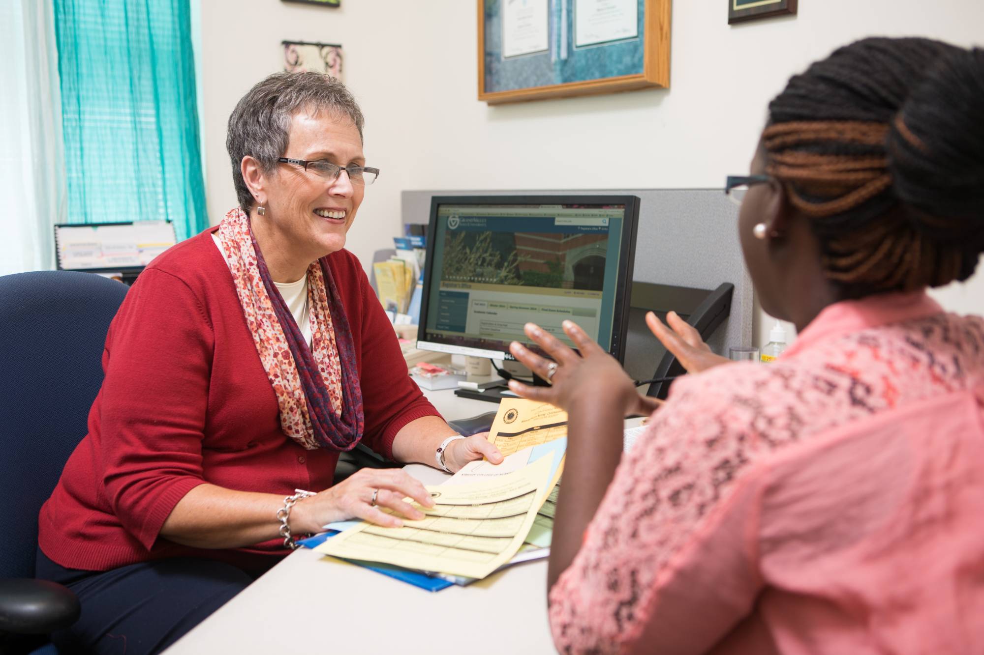 Major-specific advisor speaking with student.
